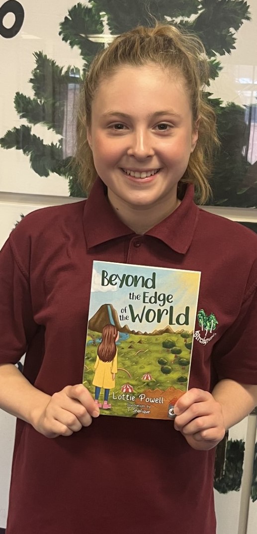 Lottie with the sample copy of her book 